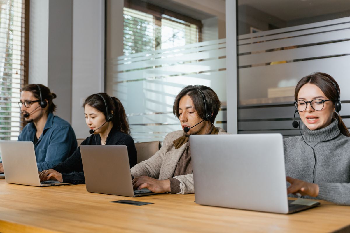 Customer support colleagues working at their desks